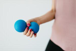 stress balls-woman squeezing stress balls