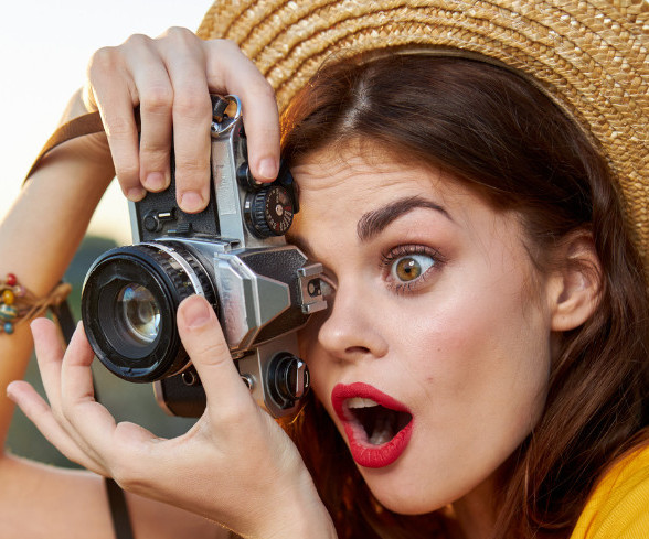 an excited woman taking pictures